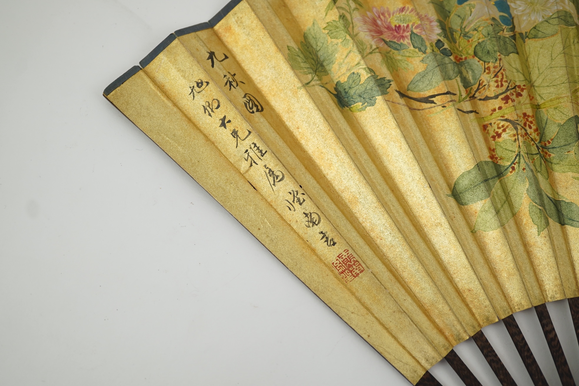 Two Chinese inscribed paper leaf fans, late 19th century